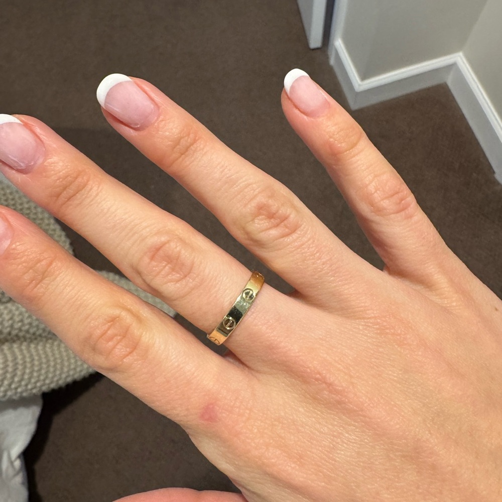 Gold Cartier love ring